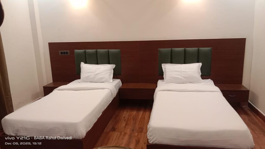 Luxury resort pool with palm trees at sunset